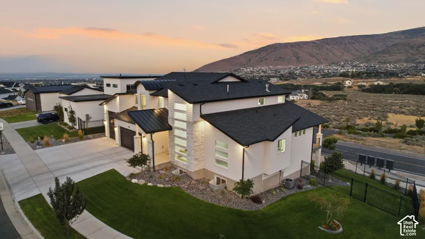 Modern architectural design featuring prominent stone and siding accents