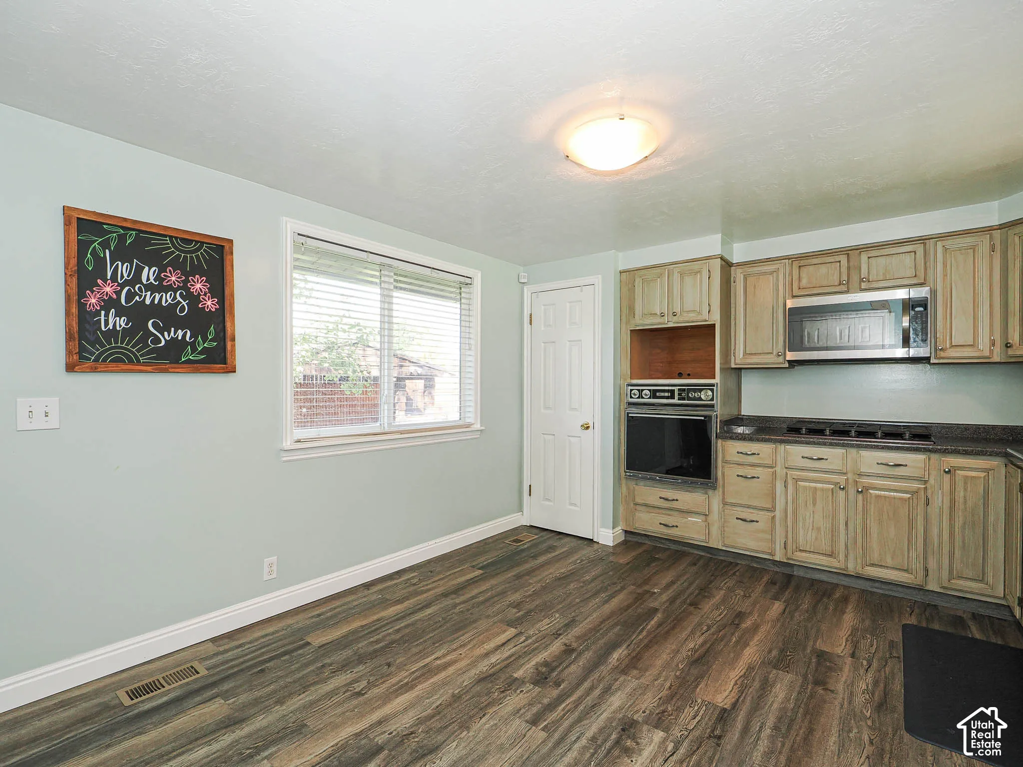 Wood-finish flooring with light-toned wall paint