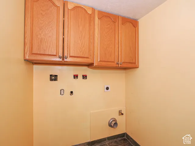 Upper cabinetry with wood-finish doors and decorative hardware