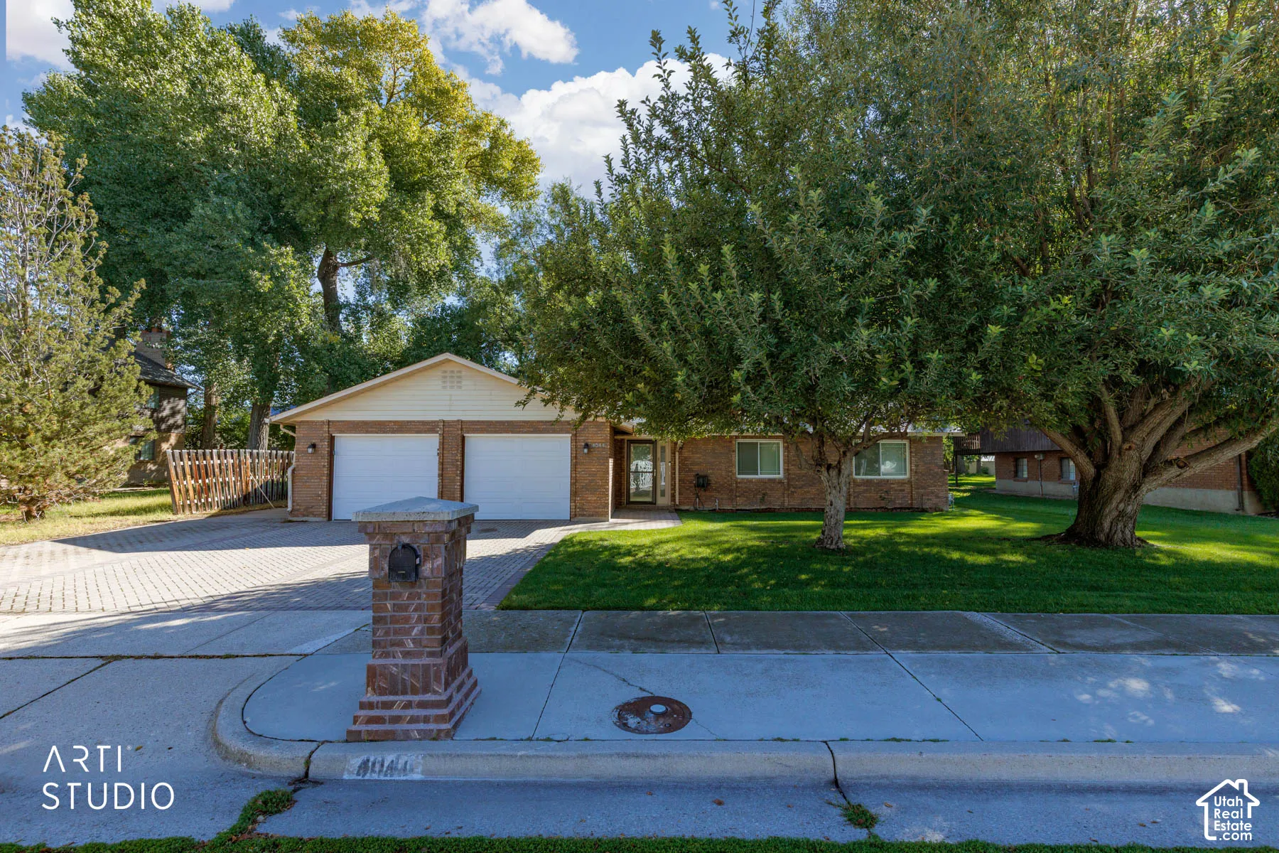 Brick exterior with a dual-bay garage