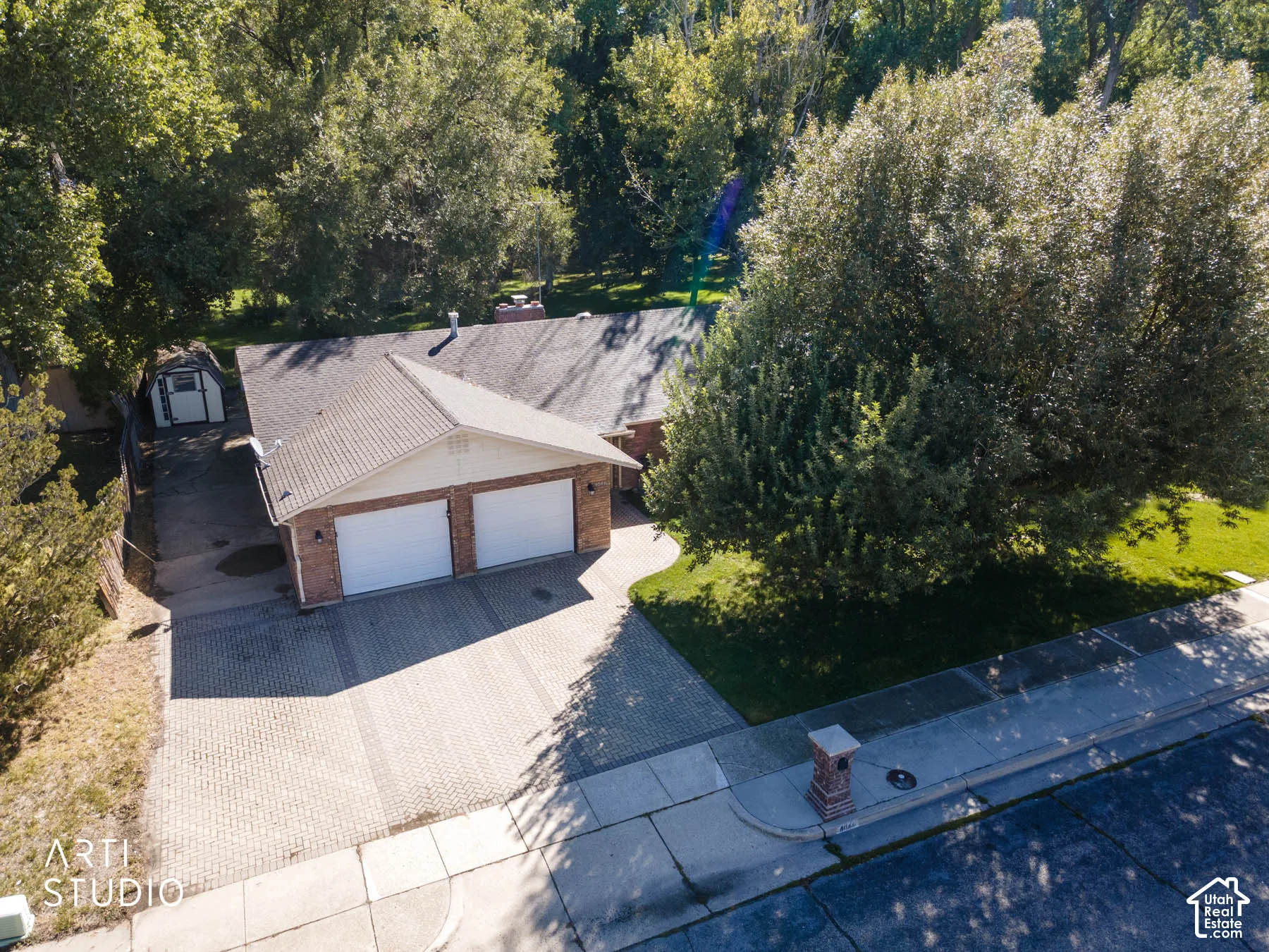 Brick exterior with a gabled roof and two-car garage
