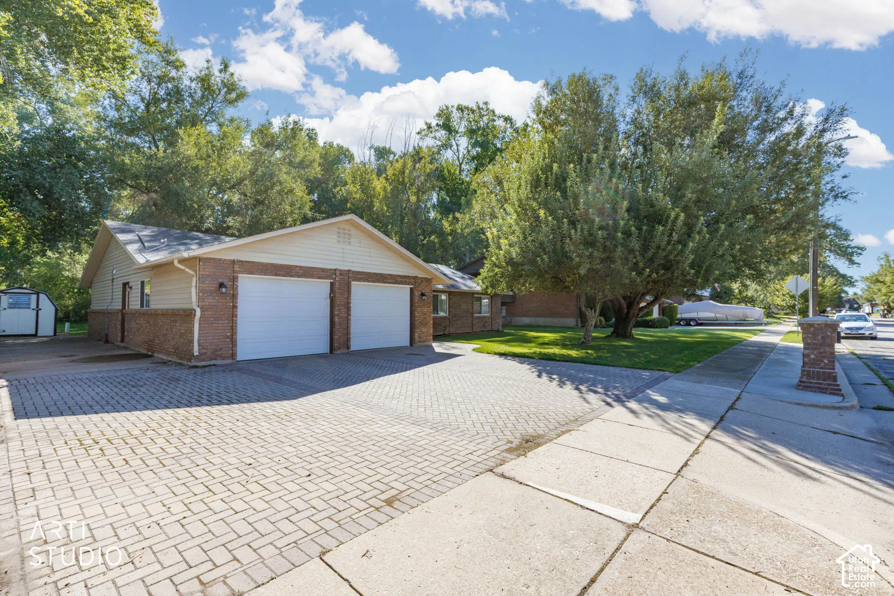 Brick and siding exterior with a two-car garage