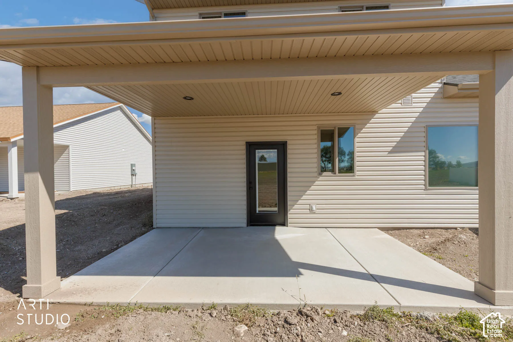 Covered patio with recessed lighting, concrete flooring, and direct exterior access