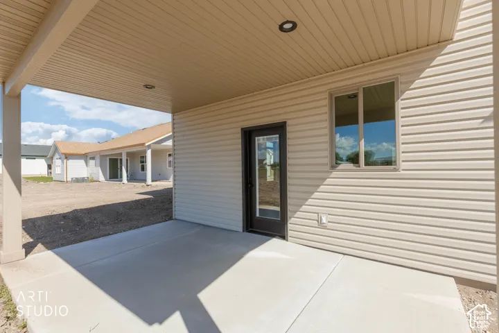 Covered patio with recessed lighting, concrete flooring, and direct exterior access