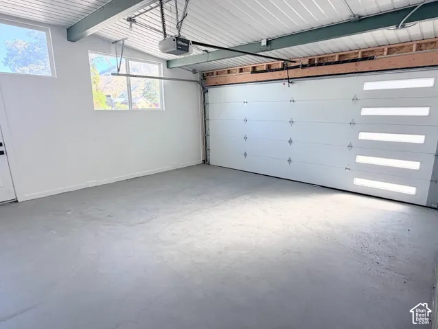 Newly Sealed Floor, Painted Garage & New Door/opener.