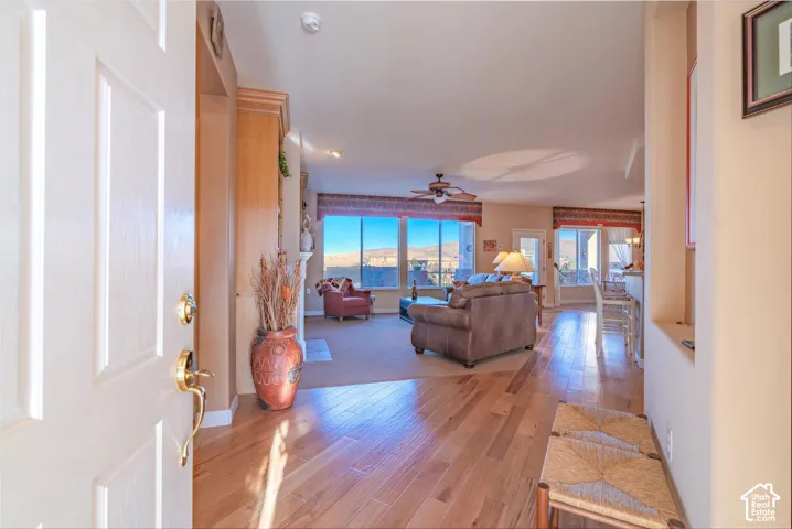 HICKORY flooring leading into an open living space with expansive windows