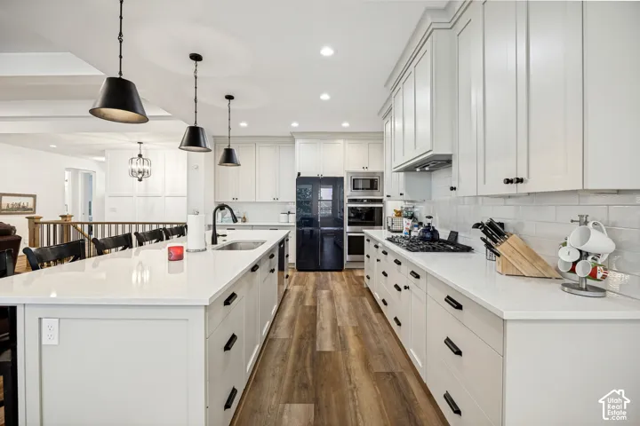 with sink, and a tiled backsplash
