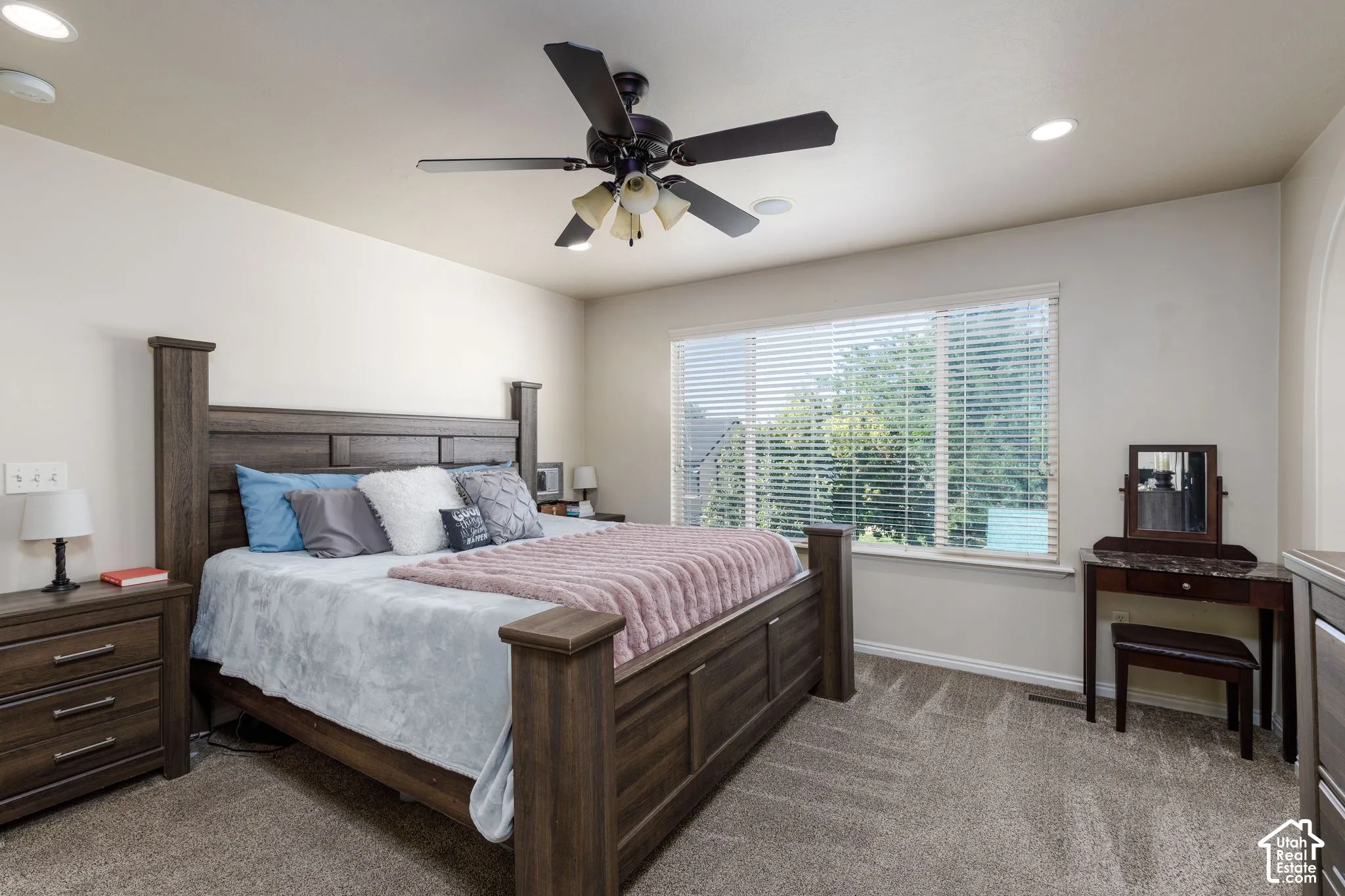 Carpeted flooring, recessed lighting, and a ceiling fan with integrated lighting