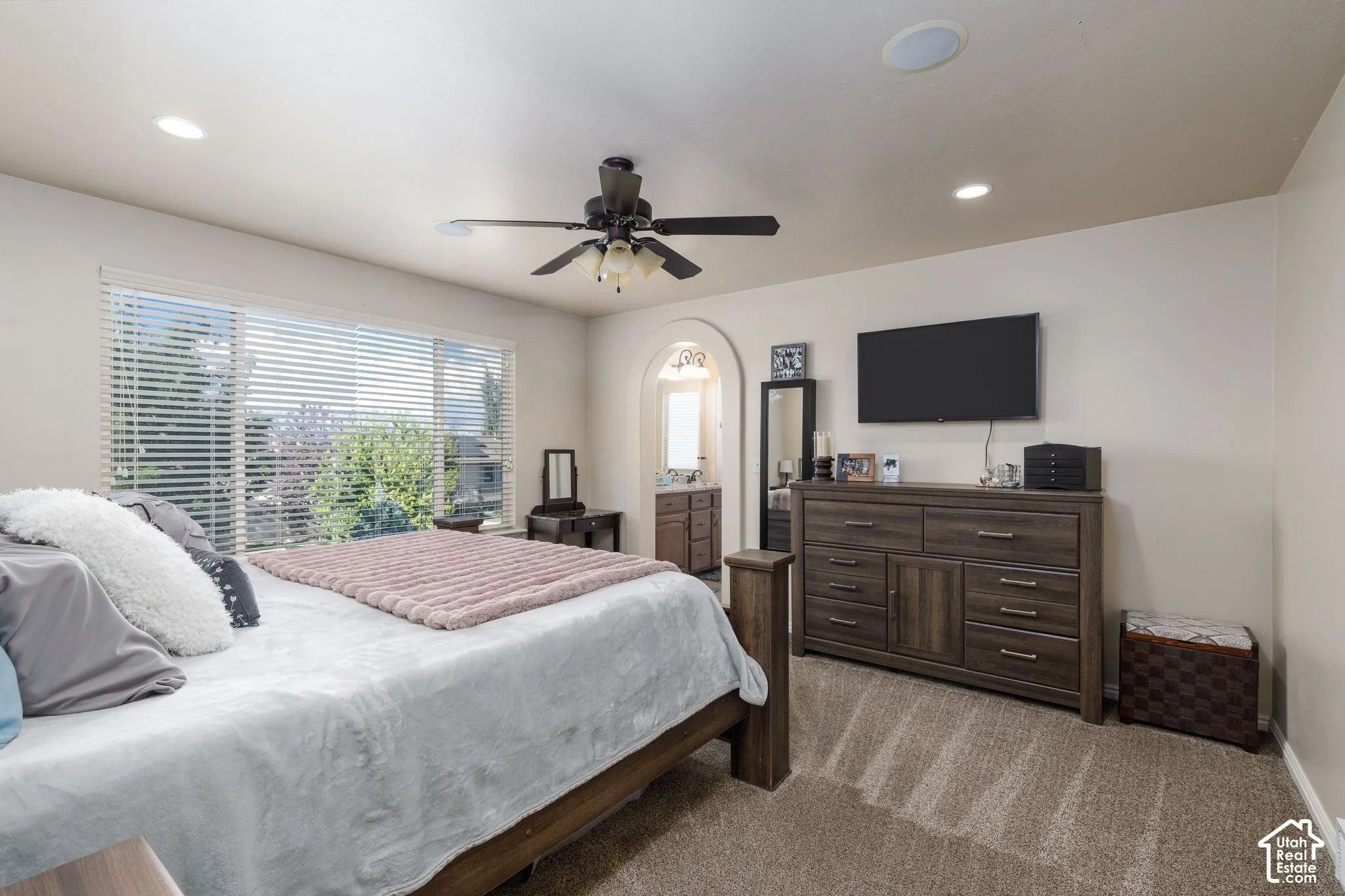 Recessed lighting, ceiling fan, and carpeted flooring