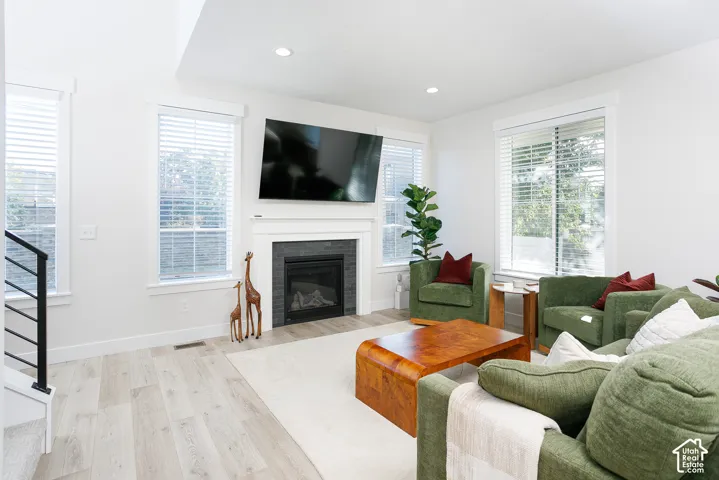 Fireplace with a dark tile surround and white mantel