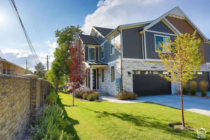 Two-story facade with stone and horizontal siding accents