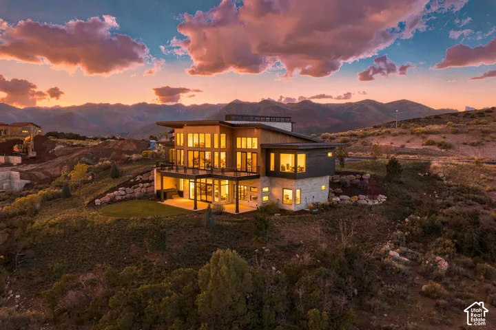 Modern architectural design with a flat roofline and extensive glass-paneled windows