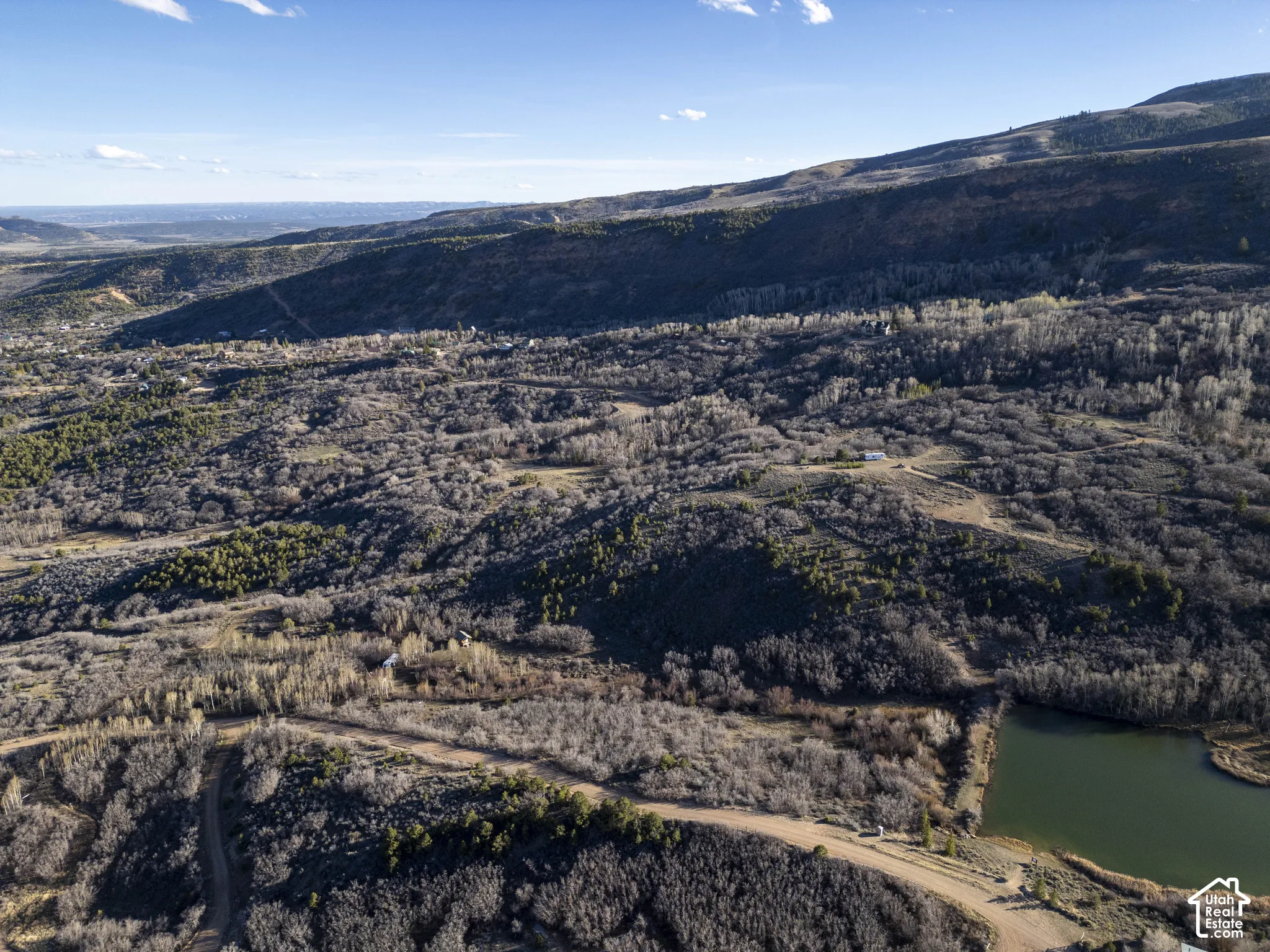 Expansive natural landscape featuring rolling hills and varied topography
