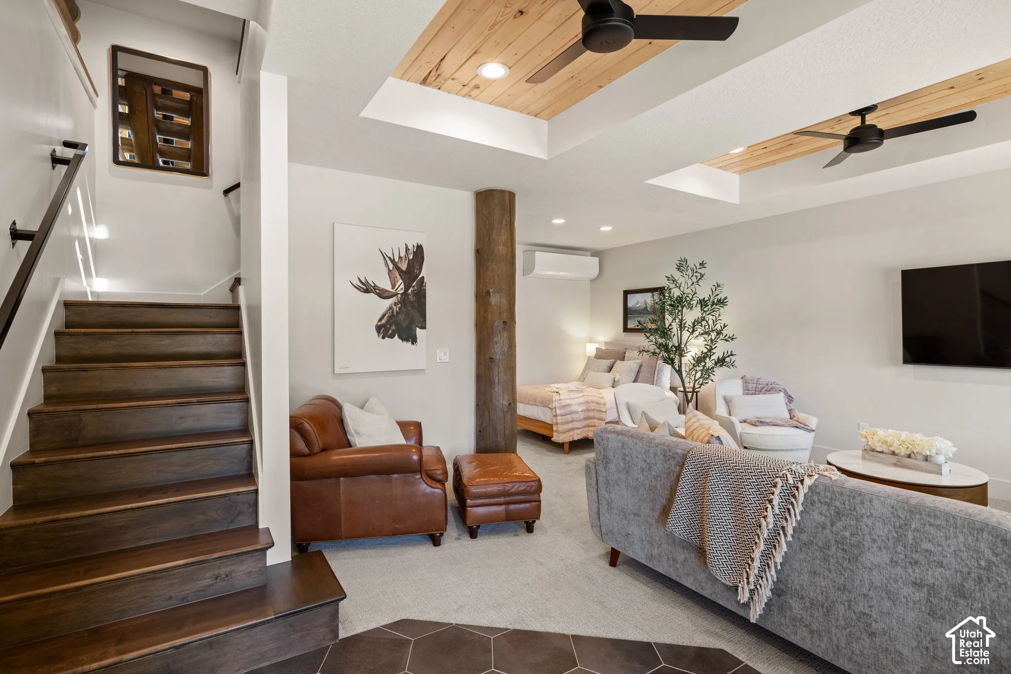 Wood-finish staircase with black handrails