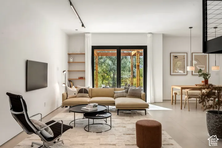 Open-concept living area featuring a neutral color palette