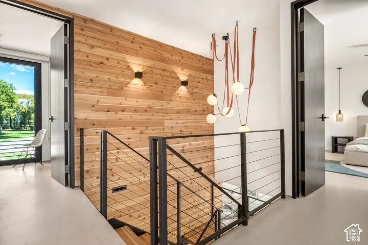 Wood-paneled wall with integrated sconces