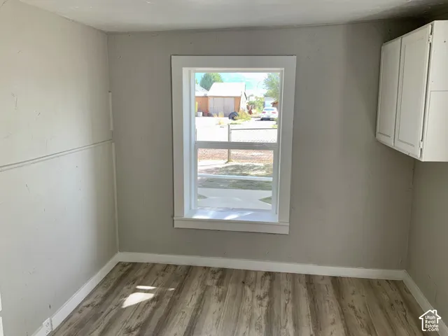 Wood-finish flooring with white trim