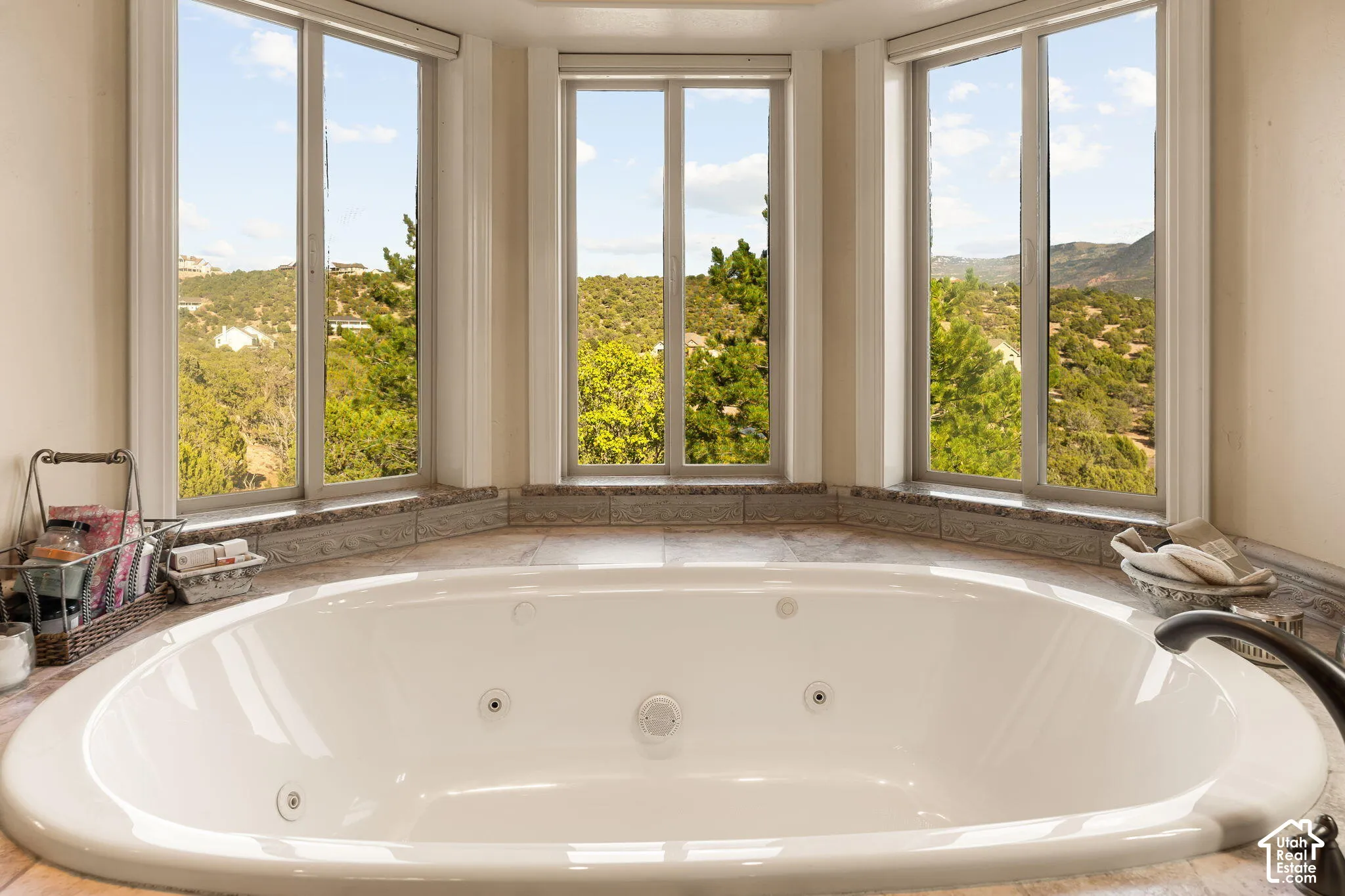 Built-in jetted tub surrounded by large bay windows