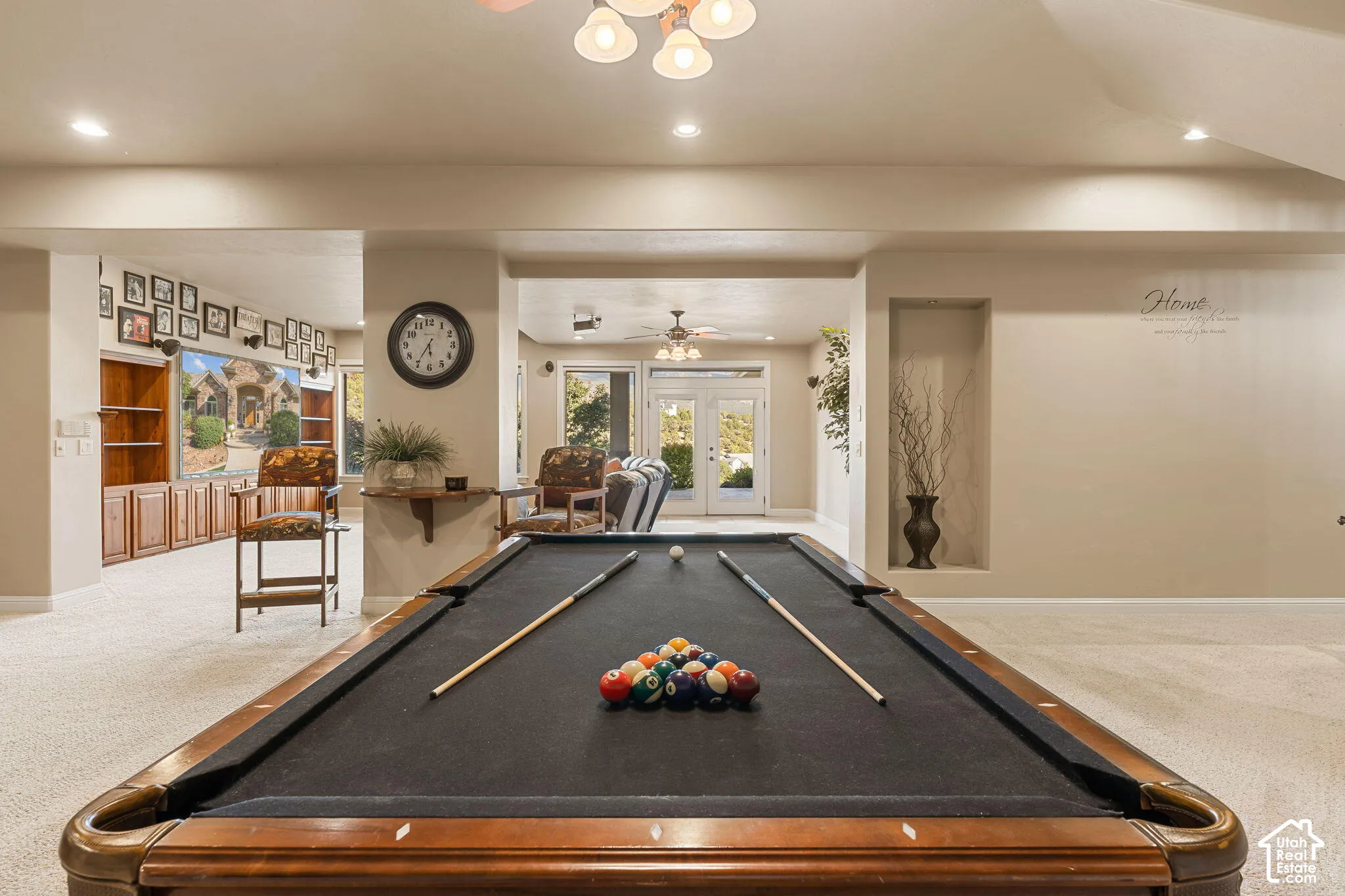Spacious recreation area featuring a pool table, recessed lighting, built-in shelving, and light-toned carpeting