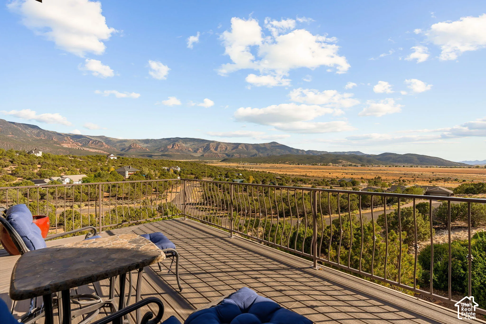 Expansive outdoor deck with mountain and valley scenery