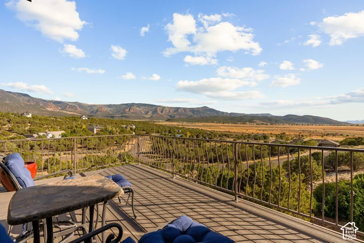 Expansive outdoor deck with mountain and valley scenery