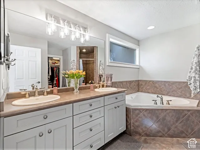 Dual vanity with integrated sinks and brushed nickel fixtures