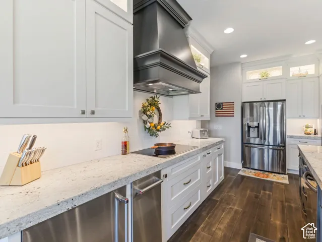 White shaker cabinetry with under-cabinet lighting