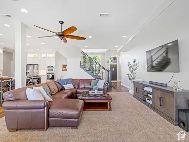 Open-concept living space featuring recessed lighting and a ceiling fan
