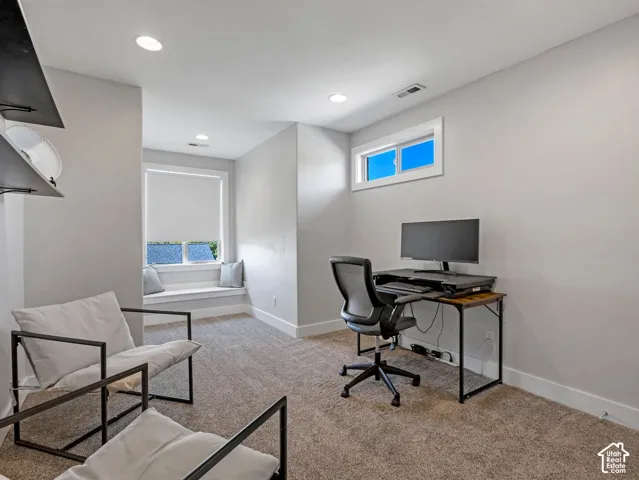 Recessed lighting, built-in window bench, light gray wall paint, white trim, and a high horizontal window