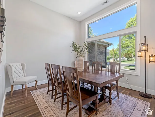 Hardwood flooring, recessed lighting, and expansive windows