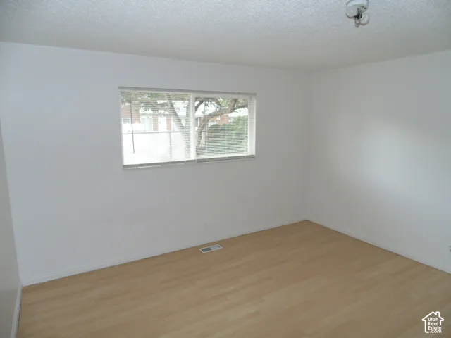 Wood-finish flooring with white walls