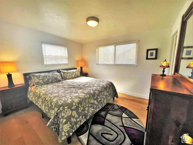 Light wood-finish flooring with white walls