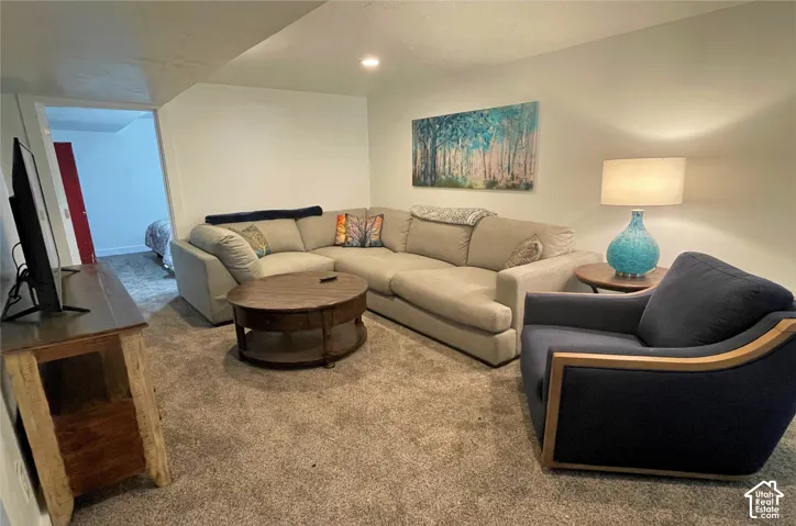 Wall-to-wall carpeting and white walls