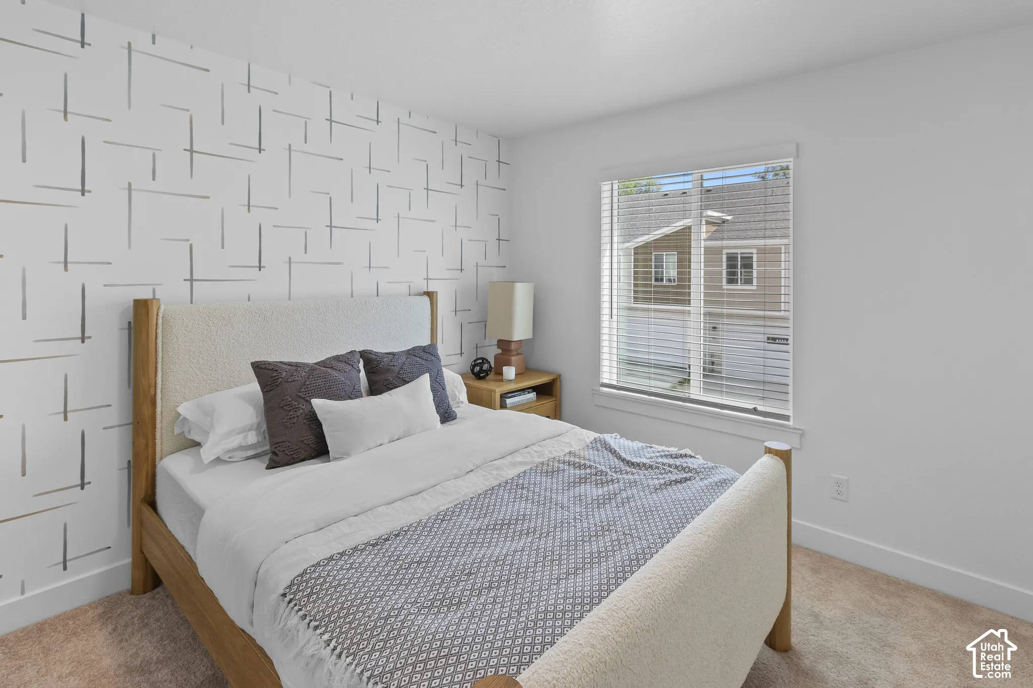 Patterned accent wall complemented by neutral paint