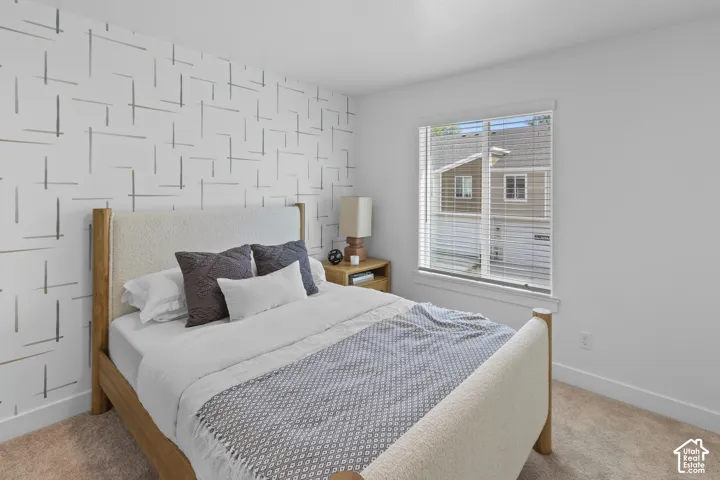 Patterned accent wall complemented by neutral paint