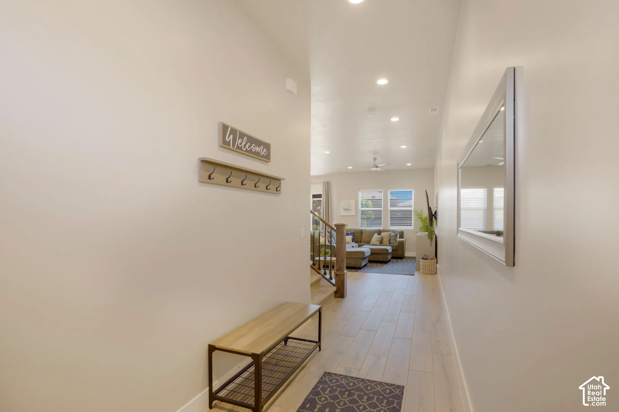 Wood-finish flooring, recessed ceiling lighting, and a neutral color palette