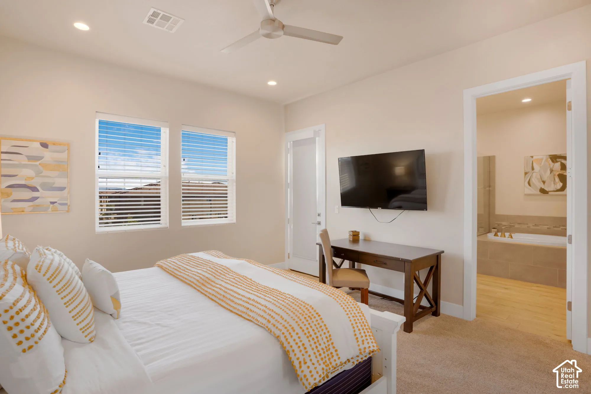 Recessed lighting, ceiling fan, and carpet flooring
