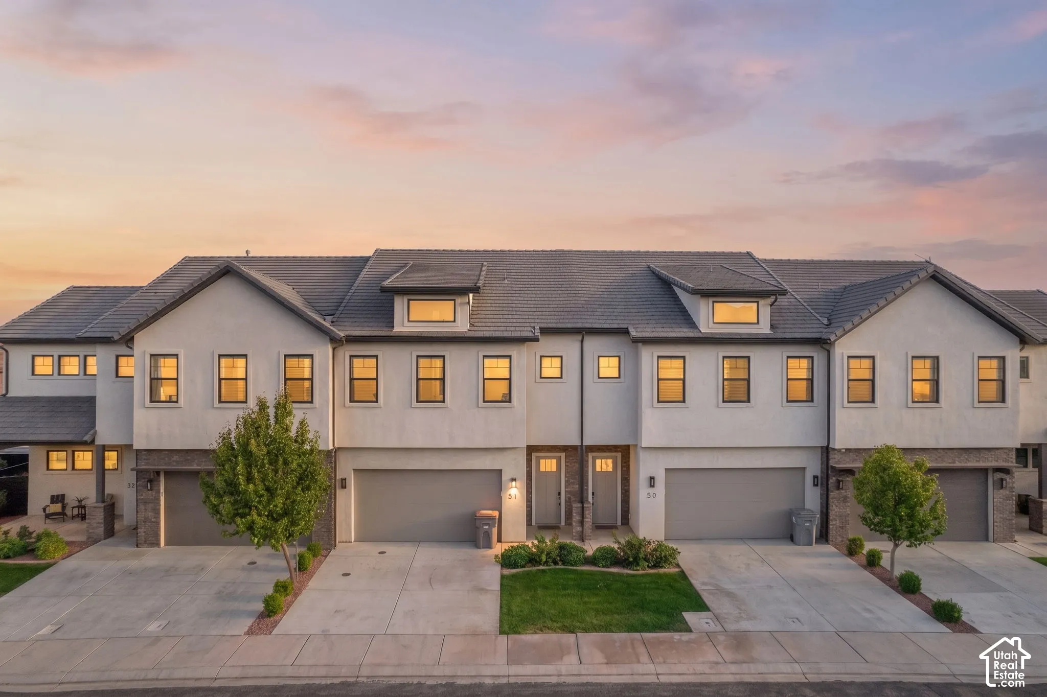 Modern townhome exterior with stucco and stone accents