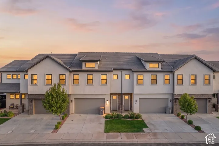 Modern townhome exterior with stucco and stone accents