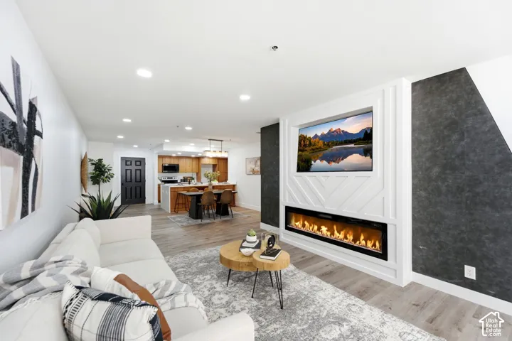 Open-concept living space with wood-finish flooring