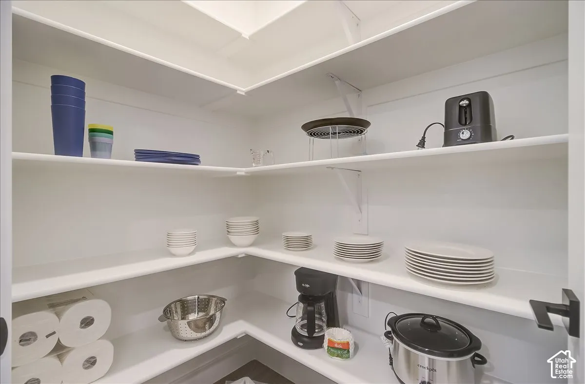 Built-in shelving with white finishes and ample storage capacity