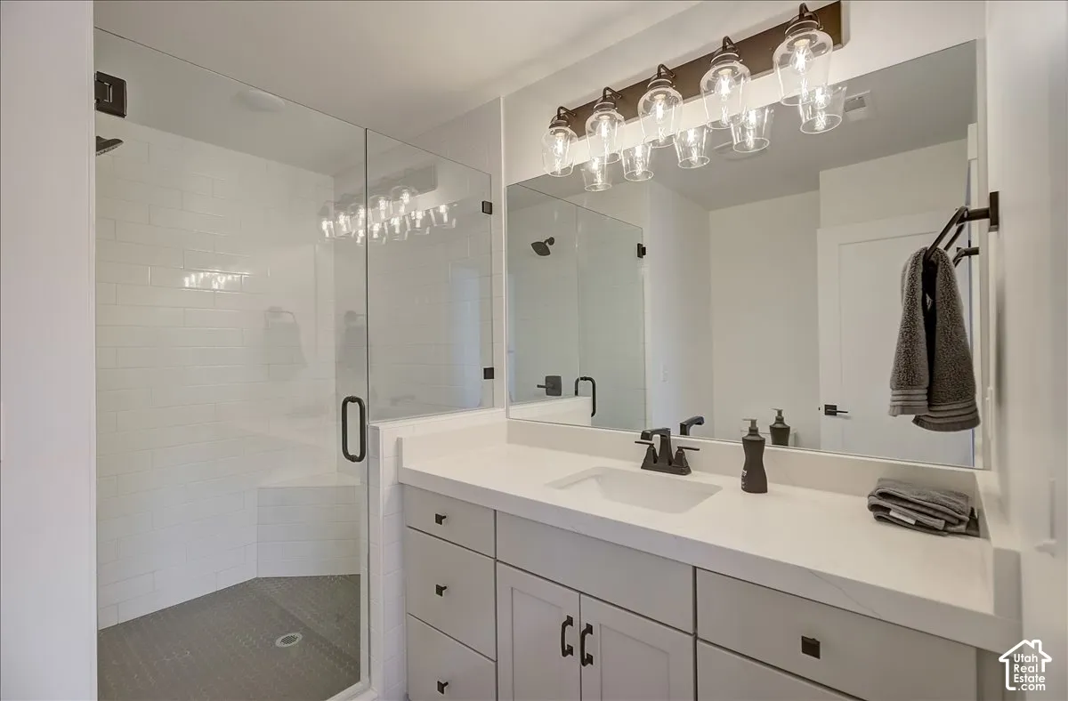 Spacious vanity with a white countertop and undermount sink