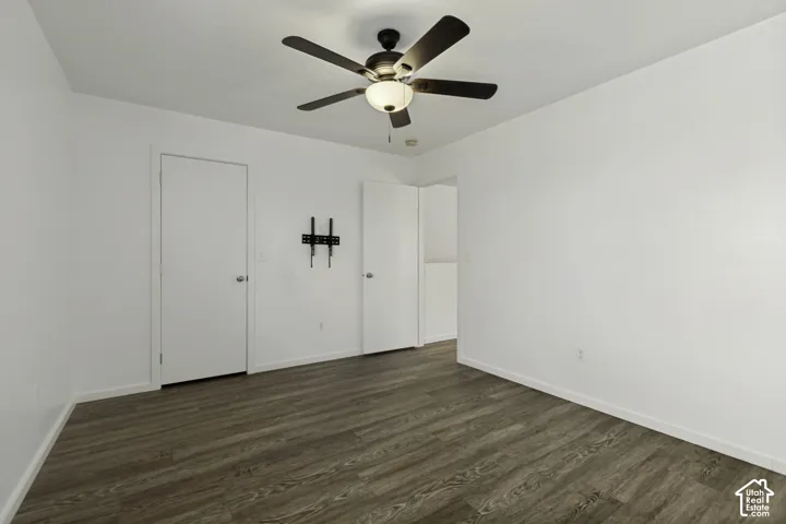 Wood-finish flooring with white walls and trim