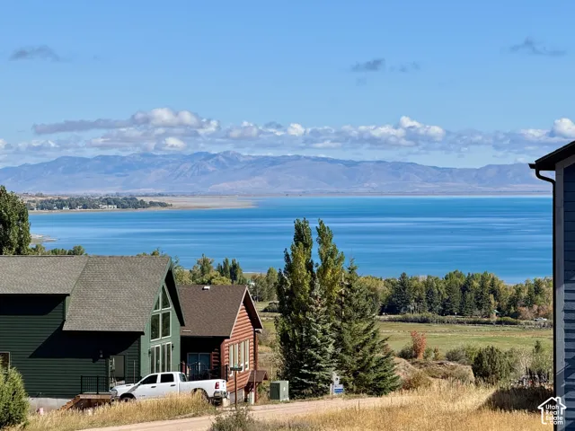 View from deck  Expansive water scenery framed by distant mountains and a clear sky