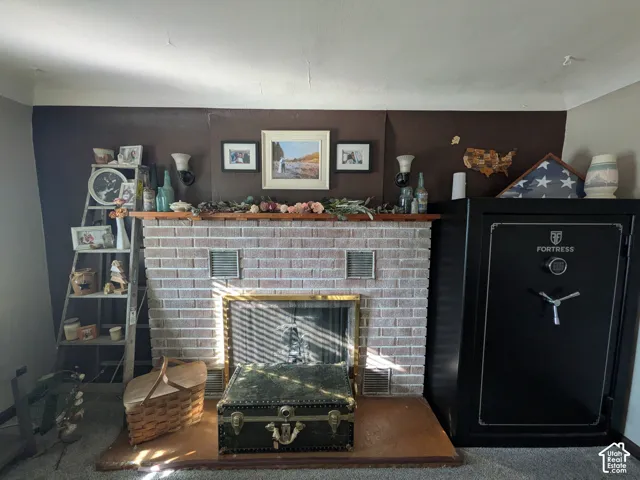 Adorable brick wood fireplace with mantel.