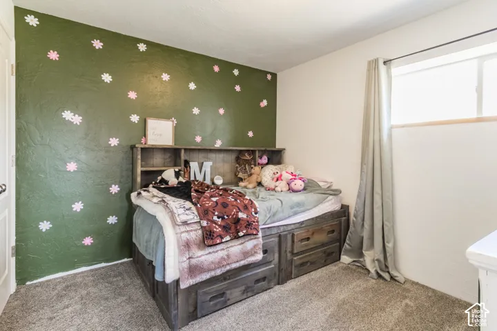 Built-in wood-finish bed frame with integrated drawers and shelving