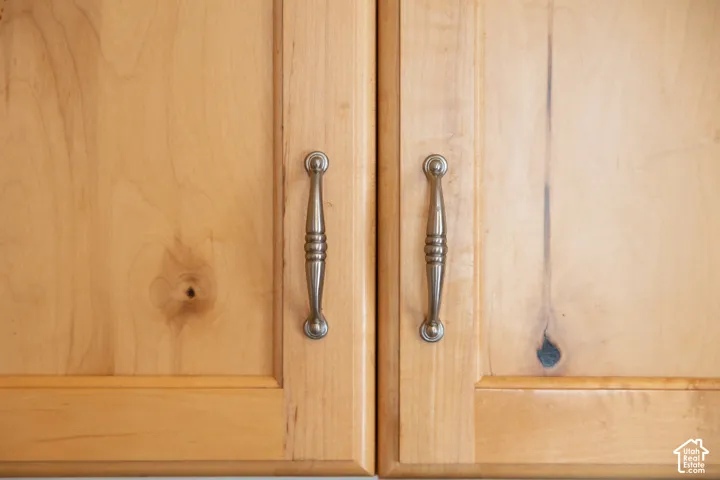 Wood cabinetry with panel detailing and brass-toned hardware