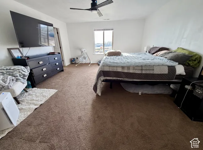 Recessed window with natural light, ceiling fan, and neutral wall color