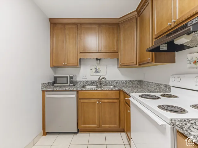 Wood-finish cabinetry paired with granite countertops