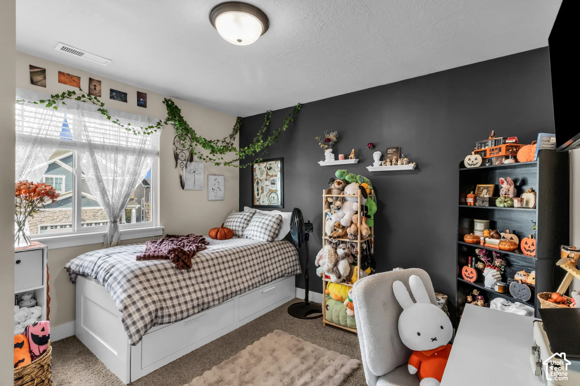 Recessed window with two-pane design, neutral wall color, built-in shelving, and overhead lighting